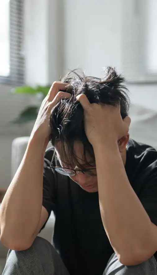 Image of upset man because of erectile dysfunction symptoms London